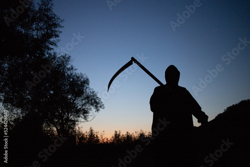 grim reaper, the death itself, scary horror shot of Grim Reaper holding scythe