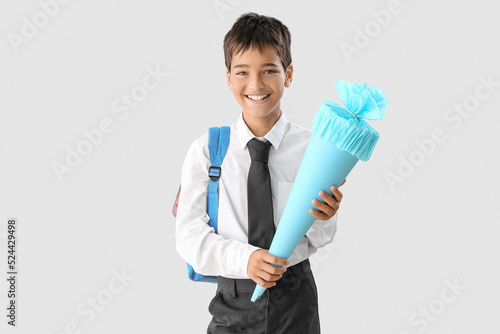 Little boy with blue school...