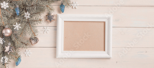 Christmas light blue background, frame for wishes, corner set. Fir branches, blue silver baubles, stars, hearts, cones, white snowflakes. Xmas, New Year festive decoration, top view, copy space.