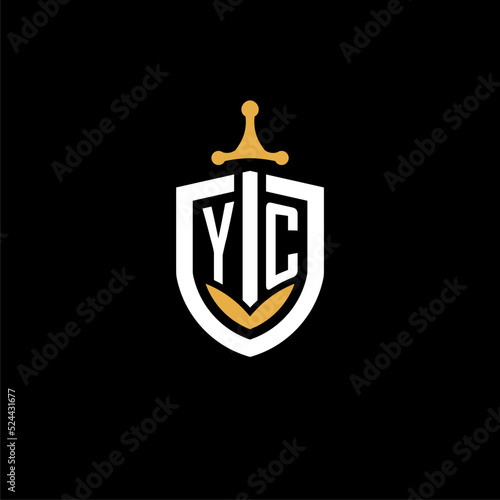 Creative letter YC logo gaming esport with shield and sword design ideas photo