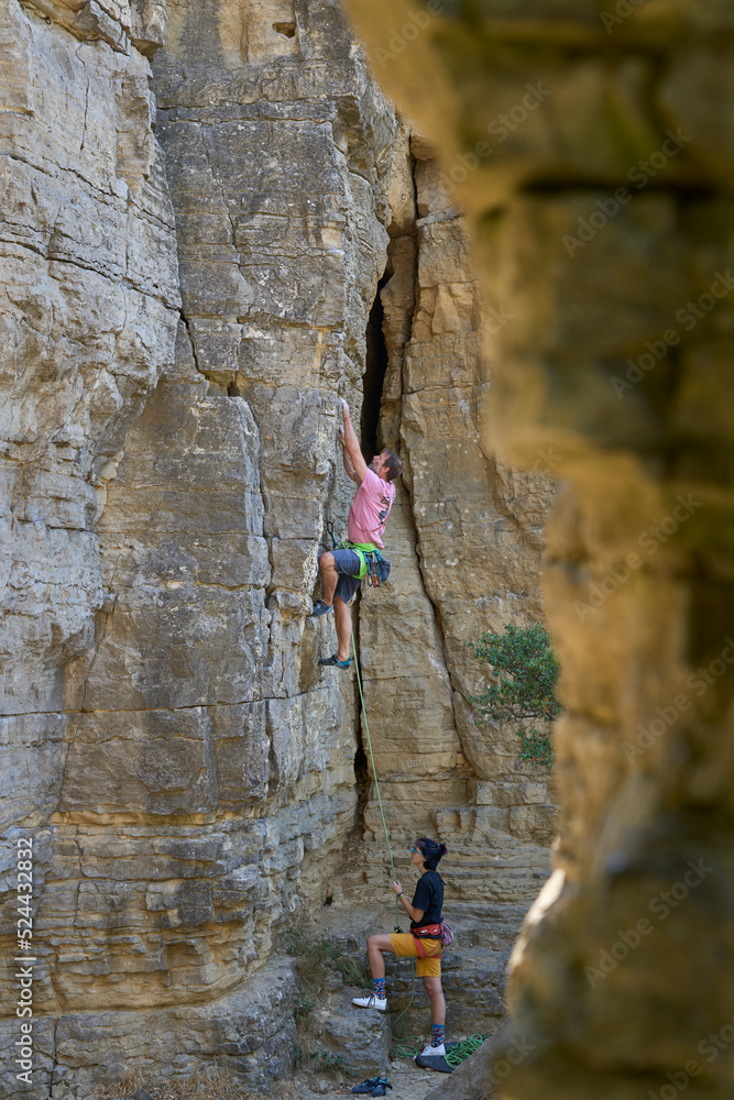 free climber  in a difficult rock climbing tour in the Rockgardens  in Hessigheim, Neckar valley, Baden-Wuerttemberg, Germany
