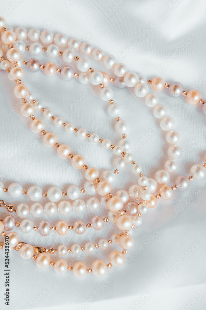 Pearls on white jewellery  , necklace of pearl ,gold
