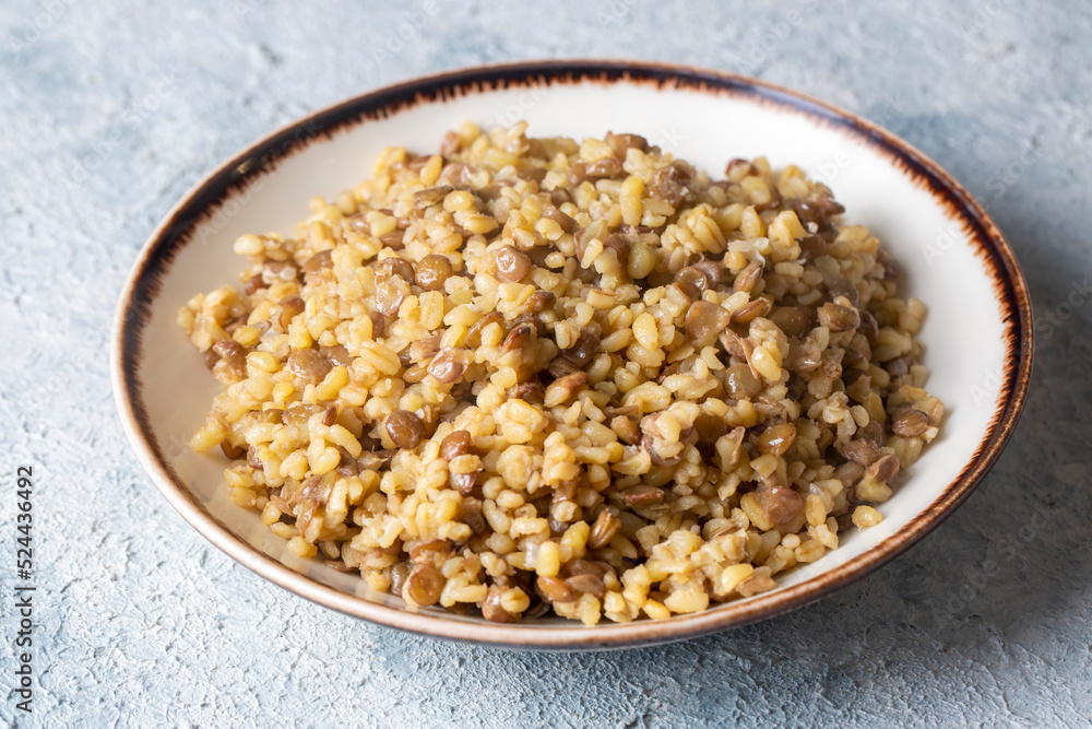 Traditional delicious Turkish foods; bulgur pilaf with green lentils (Turkish name; yesil mercimekli bulgur pilavi)