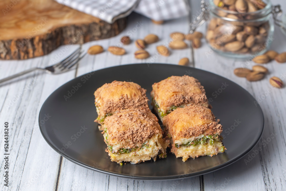 Traditional turkish new dessert cold milky baklava with pistachio (Turkish name; soguk baklava) Traditional turkish new dessert cold milky baklava with pistachio (Turkish name; soguk baklava)
