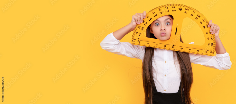 funny teen girl in school uniform hold mathematics protractor for measuring. Portrait of schoolgirl student, studio banner header. School child face, copyspace.