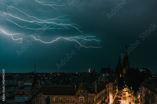 Lightning over the city at night (ID: 524442431)