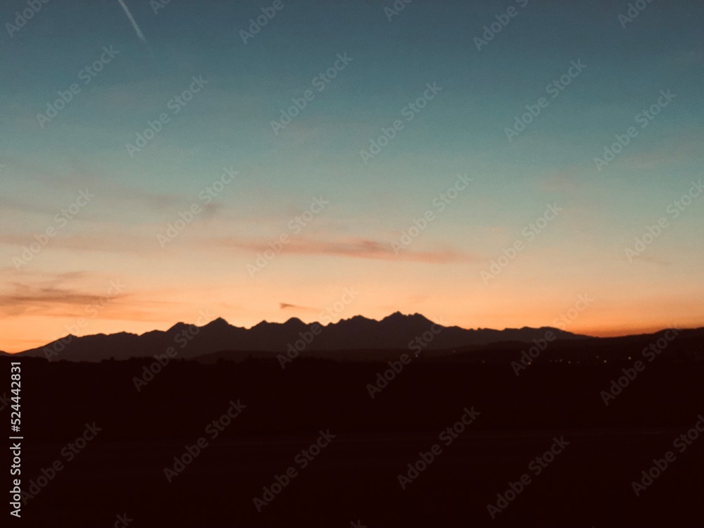 sunset behind mountains