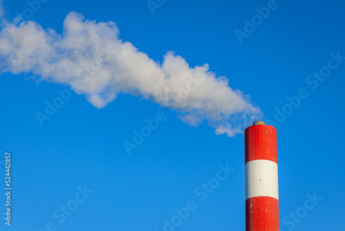 A chimney plant and white smoke in a power station in Poland