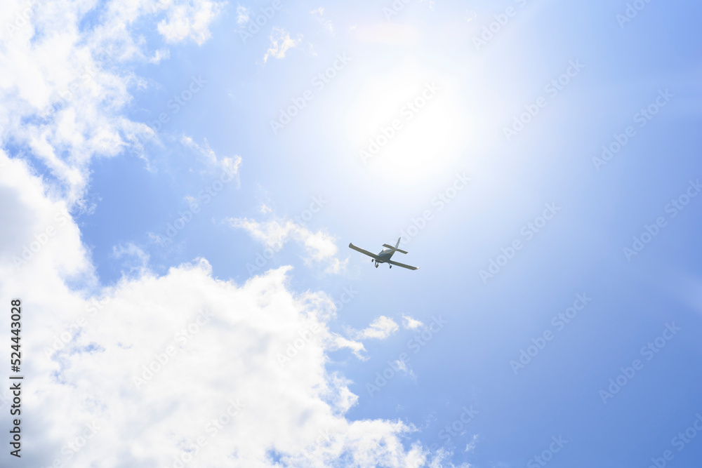 The plane is flying in the sky against the background of clouds The plane is flying in the sky against the background of clouds