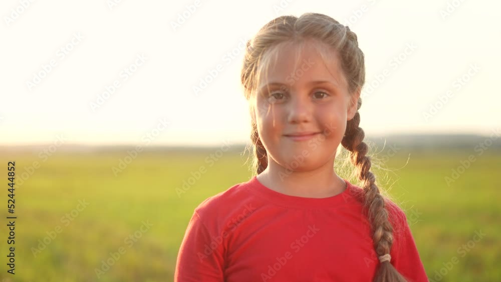 portrait of a little girl close-up on nature in the park. happy family kid dream concept. child close-up face in sunlight nature in the park. happy childhood family concept. face girl child portrait of a little girl close-up on nature in the park. happy family kid dream concept. child close-up face in sunlight nature in the park. happy childhood family concept. face girl child