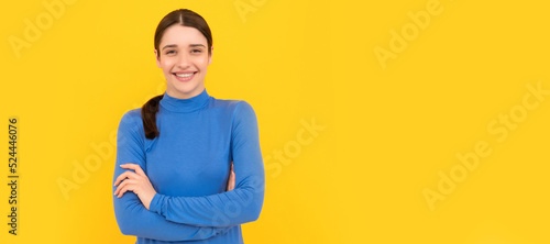 laughing woman portrait on yellow background, happpiness. Woman isolated face portrait, banner header poster with mockup copyspace. photo