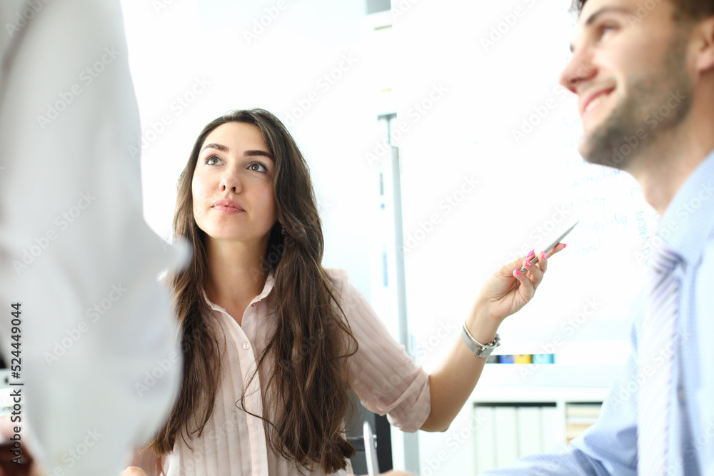 Serious professional female consultant consulting client at meeting Serious professional female consultant consulting client at meeting