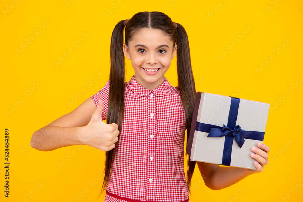 Cute child girl congratulate with valentines day, giving romantic gift box. Present, greeting and gifting birthday concept. Happy teenager, positive and smiling emotions of teen girl. Cute child girl congratulate with valentines day, giving romantic gift box. Present, greeting and gifting birthday concept. Happy teenager, positive and smiling emotions of teen girl.