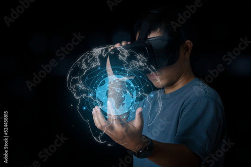 Man wearing VR glasses accessing Cloud Computing and Working with Digital Data.Virtual Global Internet connection metaverse. internet of things.Digital link tech, big data through internet technology.