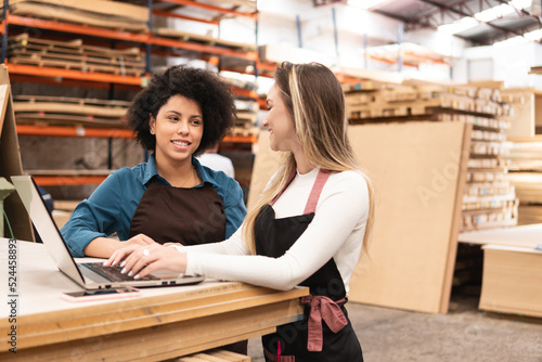 black business woman discussing sales report and delivery of product at storehouse