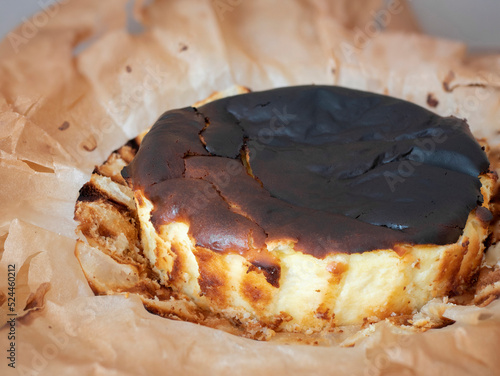 Basque Burnt Cheesecake, creamy in the middle and caramelized on the outside. Rich, dark exterior surface of the Spanish cake photo