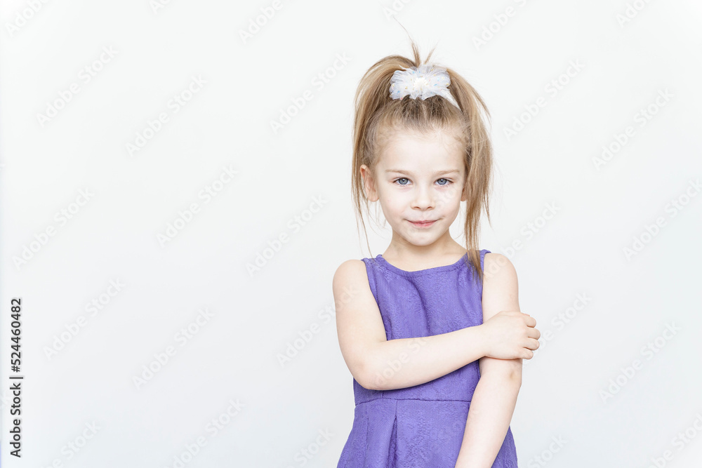 portrait of a cute 5 year old girl on a light background portrait of a cute 5 year old girl on a light background