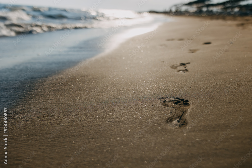 footprints on the beach at sunset footprints on the beach at sunset