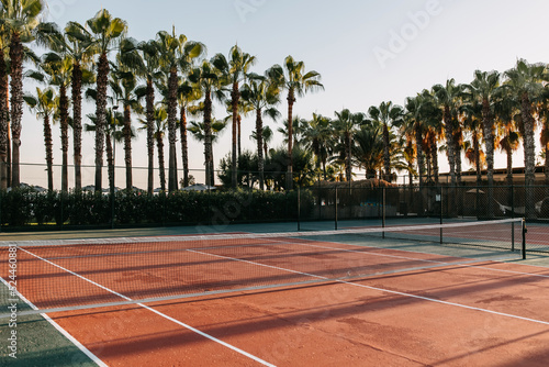 Fotografie Empty tennis court in sunrise sun light, outdoors.