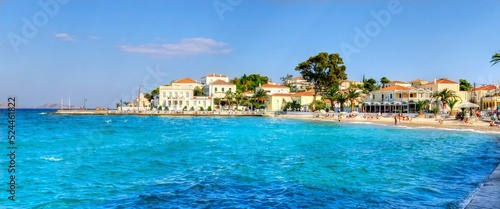  A view of the beach skyline of the beautiful Greek Island, Spetses, the coastline leading to the city and some of the local architecture.