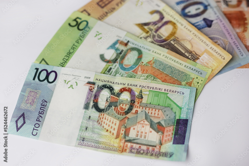 Banknotes in denominations of 100,50,20,10.5 belarusian rubles on an grey background Banknotes in denominations of 100,50,20,10.5 belarusian rubles on an grey background
