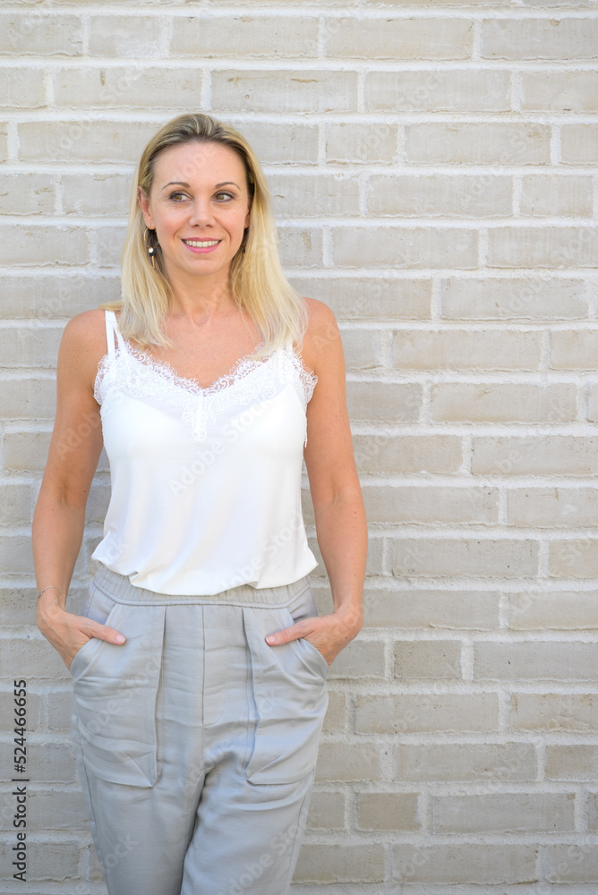 Attractive trendy slender middle aged blond woman Attractive trendy slender middle aged blond woman