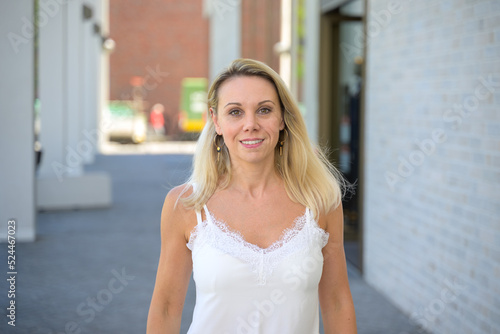 Happy blond woman with a warm friendly smile
