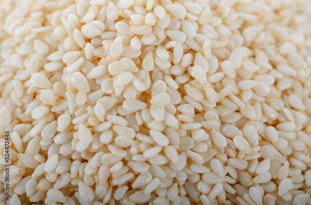 white Sesame Seeds in bowl on white background