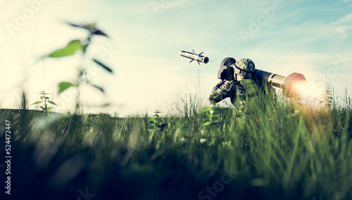 Soldier firing anti-tank missile at war photo