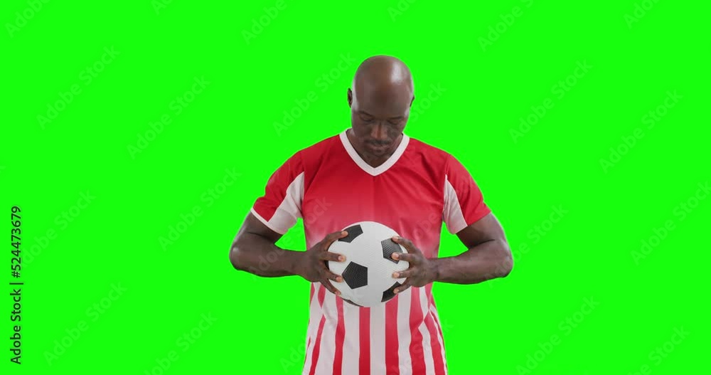 Video of african american male soccer player holding ball on green screen background Video of african american male soccer player holding ball on green screen background