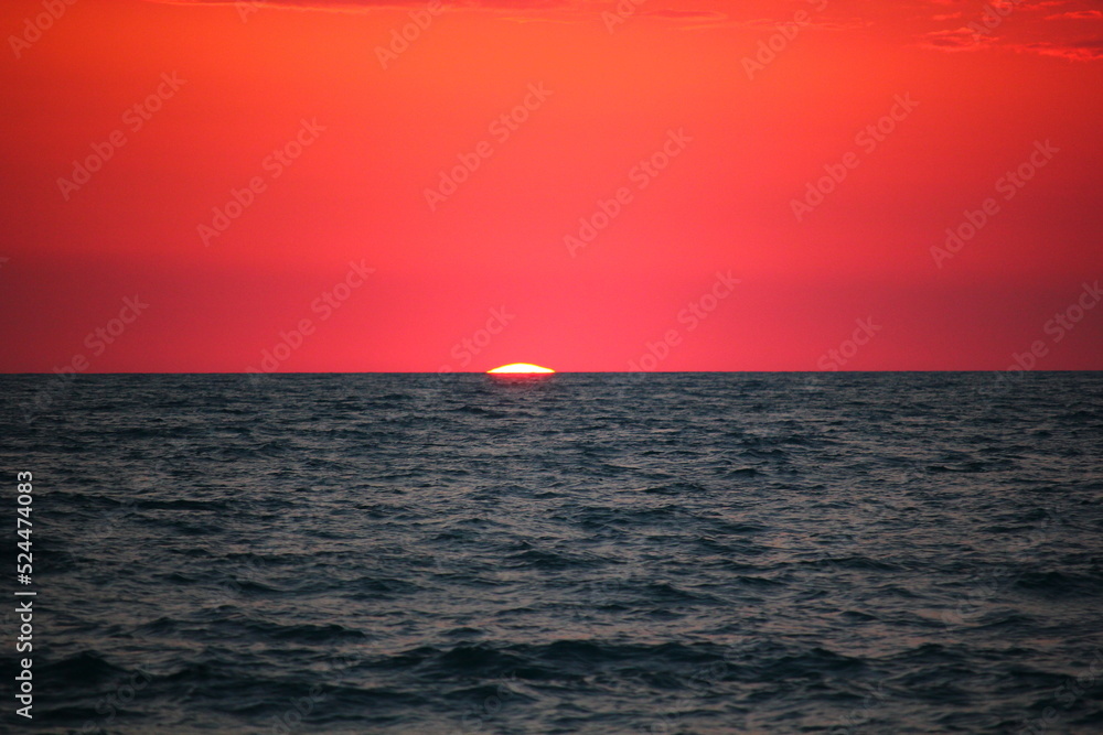 pink sunset over the sea.the sun almost went below the horizon