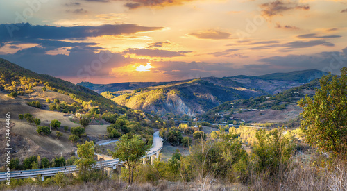 Panoramic rural landscape at sunset. Basilicata region, Italy