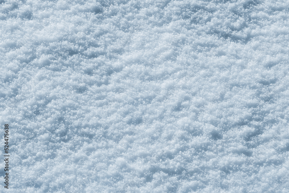 Texture of snow in sunny weather. Snow cover with snow crystals Texture of snow in sunny weather. Snow cover with snow crystals