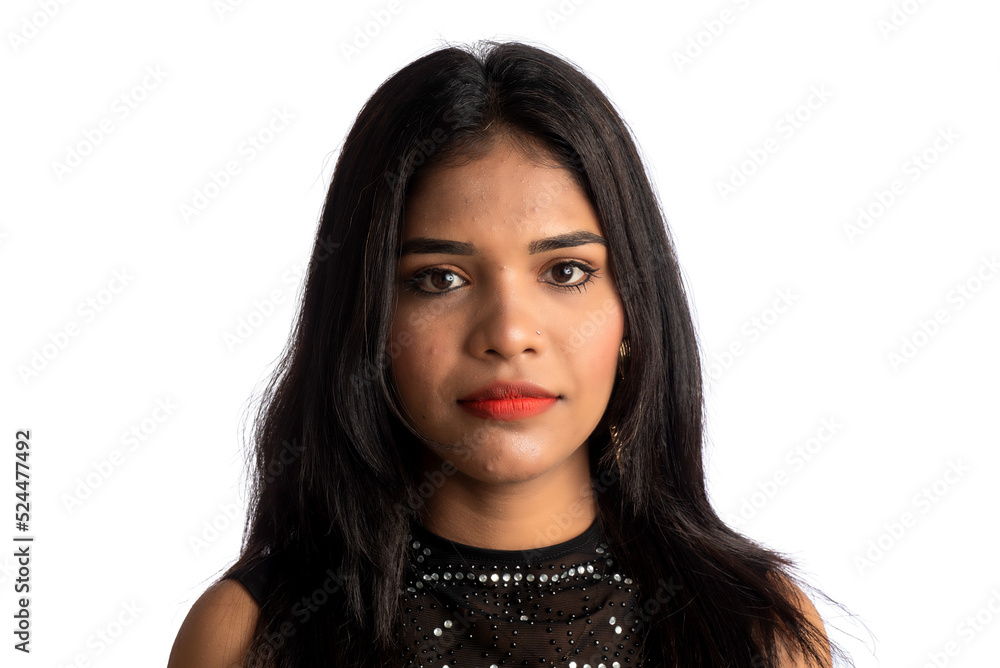 Portrait of a young girl wearing black dress posing on a white background Portrait of a young girl wearing black dress posing on a white background