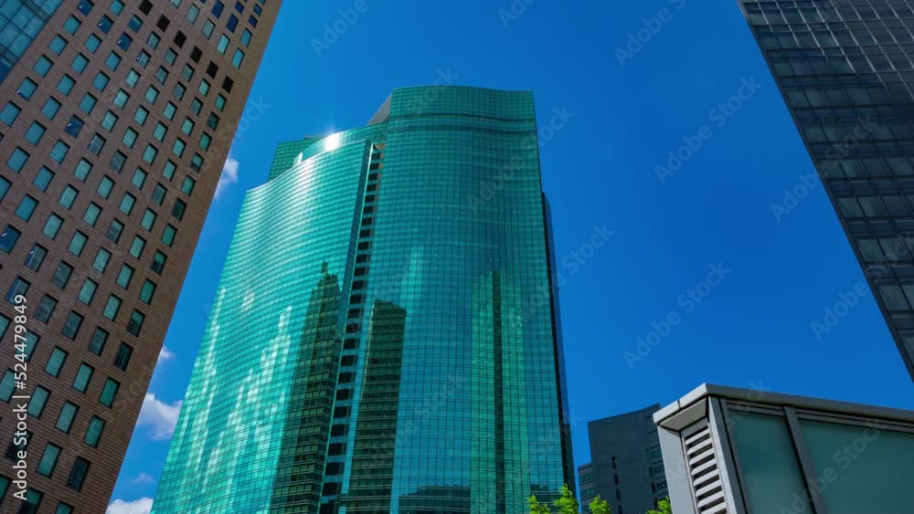 A timelapse of cloud reflecting the building in the business town wide shot panning A timelapse of cloud reflecting the building in the business town wide shot panning
