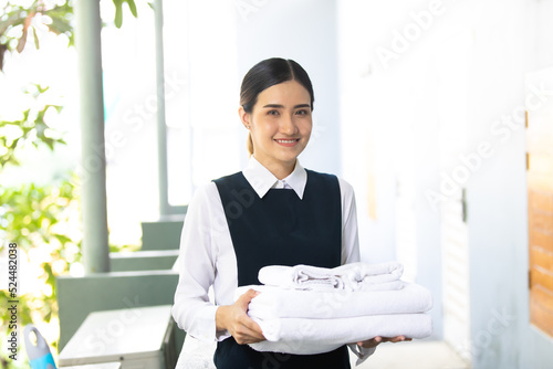 Photos Housekeeper or Maid cleaning hotel room