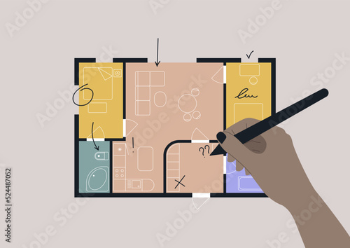 Hand editing an architectural floor plan of a two bedroom apartment with a bathroom and a dining area combined with a living room