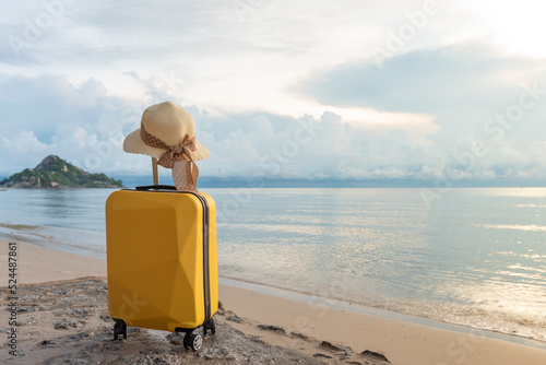 Traveling suitcase on the beach, Hua Hin  Thailand. © May_Chanikran