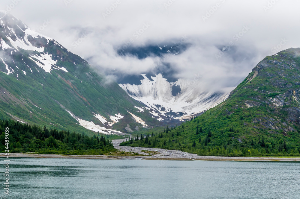 A view of a moraine filled river on the side of Glacier Bay, Alaska in summertime