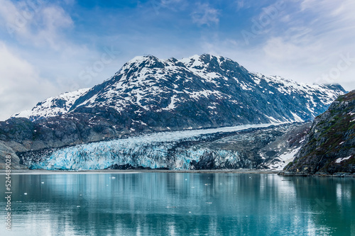 A close up view across the waters of Glacier Bay towards the Reid Glacier, Alaska in summertime