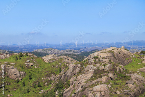 View from the Trollpikken mountain in Magma UNESCO Global Geopark to a wind farm, south Norway