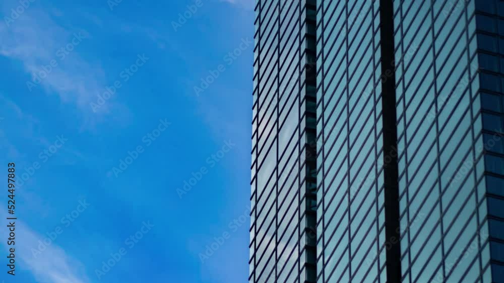 A timelapse of cloud reflecting the building in the business town long shot panning A timelapse of cloud reflecting the building in the business town long shot panning