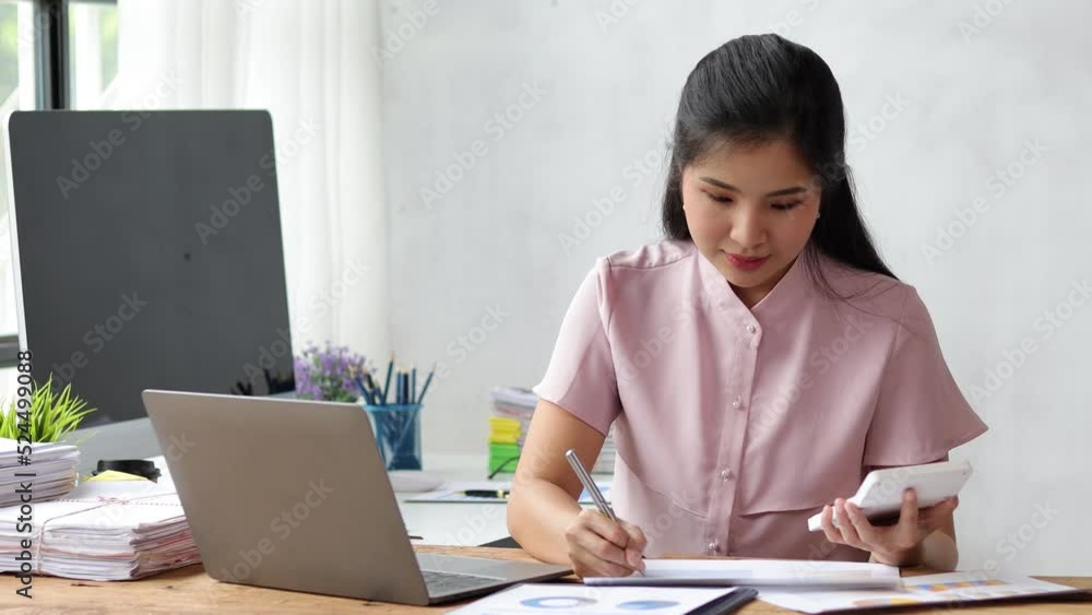 Businesswoman at office desk working on laptop and calculating accounting budget for financial planning for budget allocation. Businesswoman at office desk working on laptop and calculating accounting budget for financial planning for budget allocation.