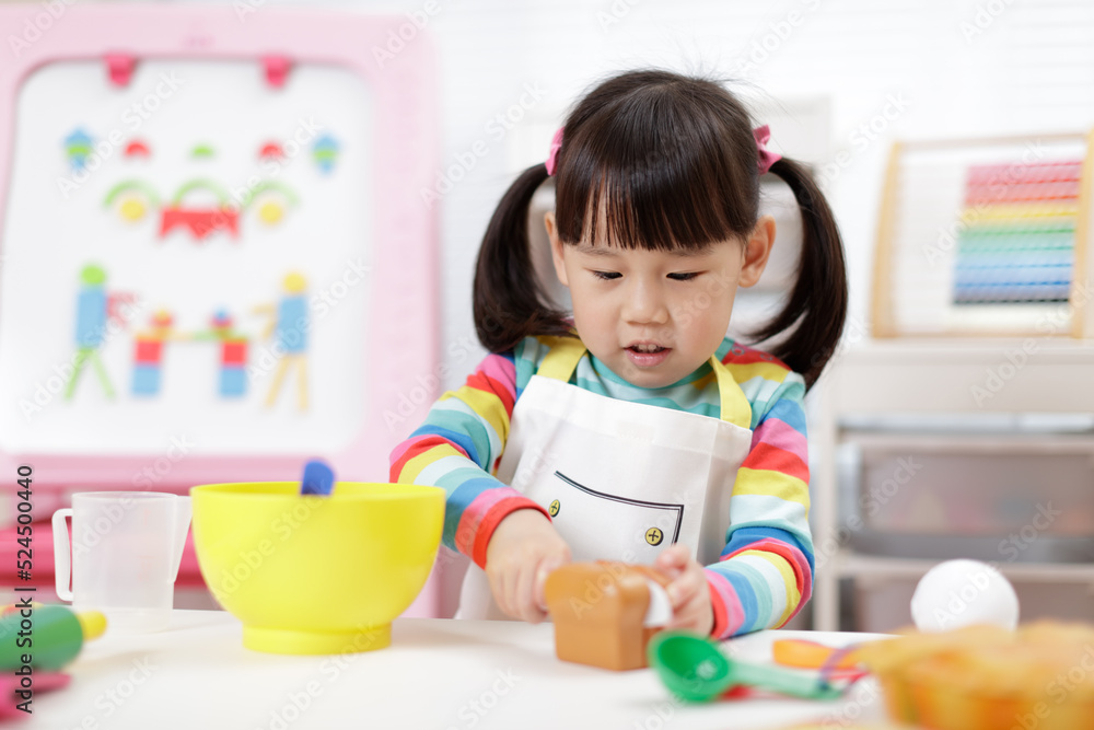 young girl pretend playing food preparing at home young girl pretend playing food preparing at home