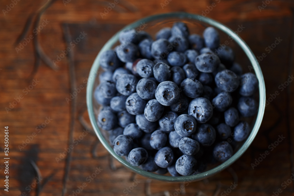 Blueberries in a bawl, fresh berry on the wooden table Blueberries in a bawl, fresh berry on the wooden table