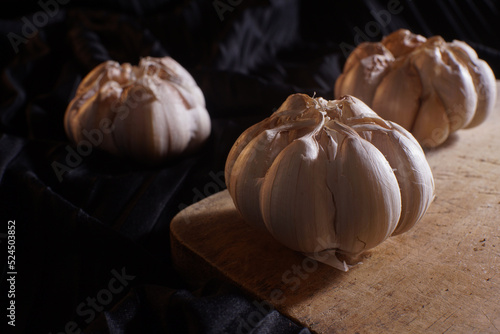 cloves of garlic on a black background