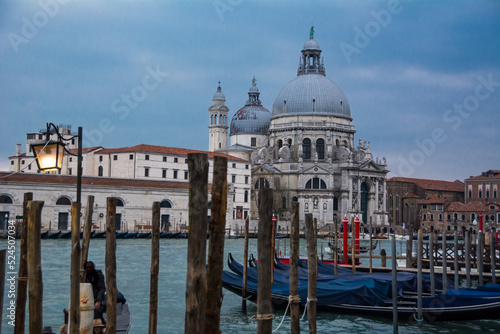Two domes and a tower and gondolas in the Grand Canal of Venice, Veneto, Italy.
