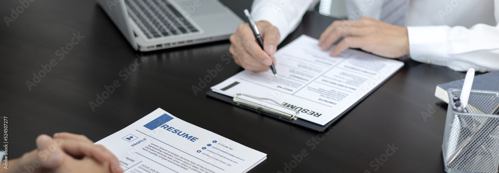 Employer or HR department is reading the resume and interviewing the ability of new employees, job interview with applicants, Using psychology in job interviews, Employment and Recruitment Concept. Employer or HR department is reading the resume and interviewing the ability of new employees, job interview with applicants, Using psychology in job interviews, Employment and Recruitment Concept.