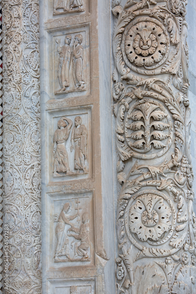 Decorative portal, entrance to Pisa Baptistery on Piazza del Duomo, Pisa, Italy