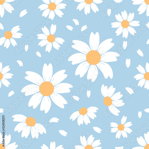 Seamless pattern with hand drawn daisy flower and flying petals on blue background vector. Cute floral print.